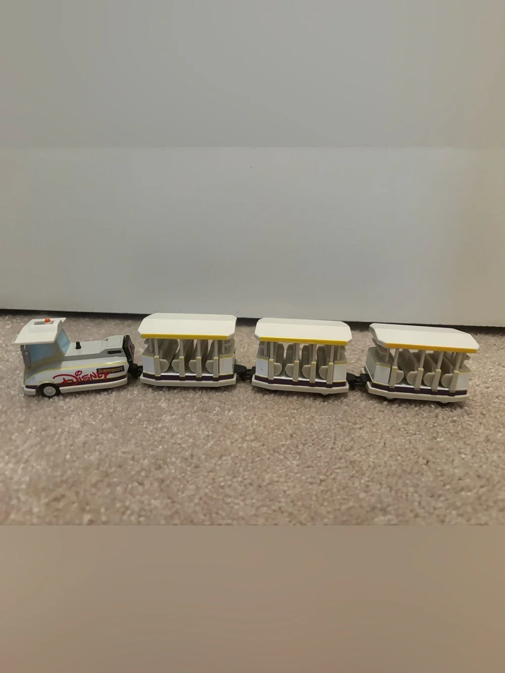 Disney Parks Parking Lot Tram 4 Piece Diecast Metal Toy Vehicle Car Set